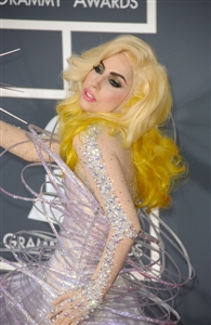 Lady Gaga seems to enjoy bejeweled getups and luminescent materials. 