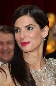 Sandra Bullock was sporting a sleek vintage hairstyle when she accepted her Oscar. 