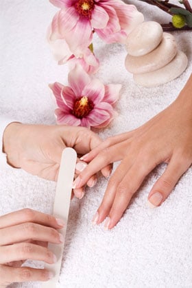 Get cuticle work and hard skin removed at a nail salon