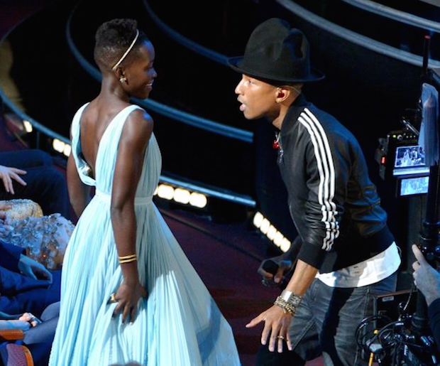 Williams dances with a soon-to-be-very-happy Lupita N'yong'o