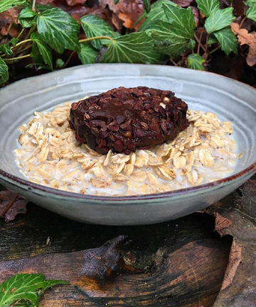 Jumbo Oats in Oat Milk Topped with a Cacao Energy Ball