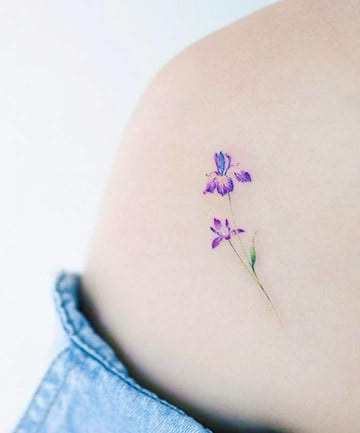 Tiny purple flowers tattoo on the wrist  Tattoogridnet