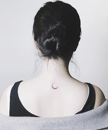 Crescent moon tattoo done on the wrist minimalistic