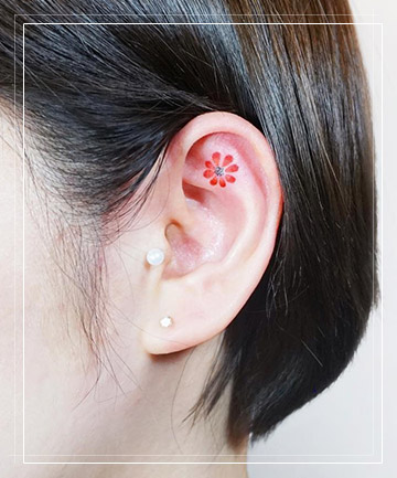 Flower ear tattoo with piercing | Flower tattoo ear, Ear tattoo, Inner ear  tattoo