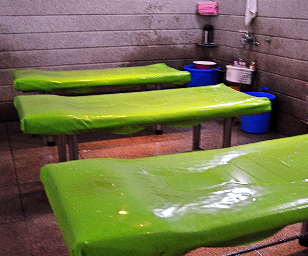 The plastic tables common in Korean spas, used for stripping spa visitors of their skin. 