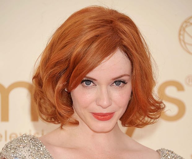 Hairstyles for Big Foreheads: Voluminous with Side-Parted Bangs on Christina Hendricks